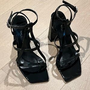 Tony bianco heels. Black patent leather, size 5.5. Only worn in the house.